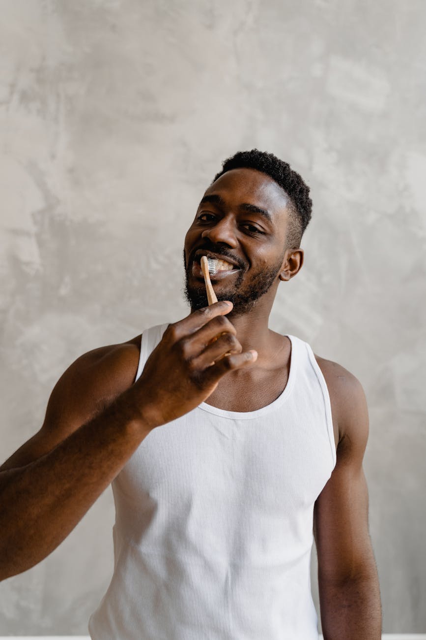 a man brushing his teeth